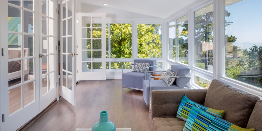 3M tint photo of the interior of a sunroom during daytime