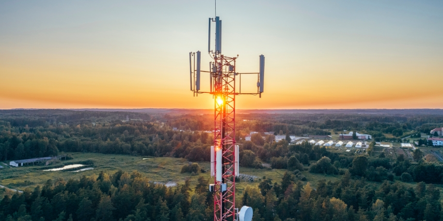 cell tower the top of a cell phone tower at sunset