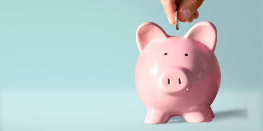 piggy bank deposit a coin deposited into a piggy bank