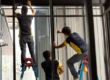 men applying residential window tinting