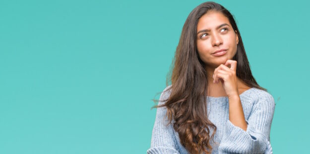 woman looking thoughtful woman looking thoughtful
