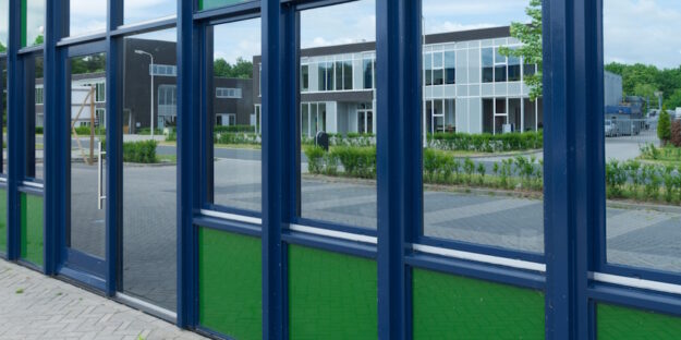 commercial building with reflective tinted windows commercial building with reflective tinted windows