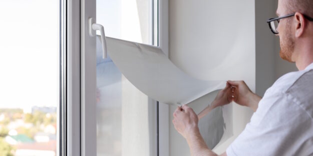 home window tint being applied