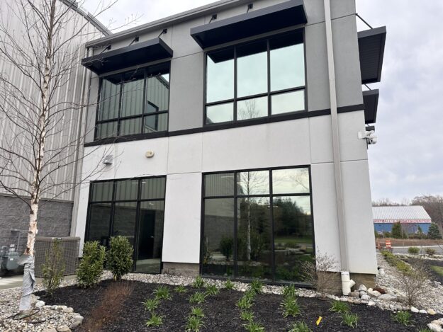 IMG_2167 Exterior of a commercial building with professionally installed window tint by Energy Solutions Window Tinting, reducing glare and enhancing energy efficiency.