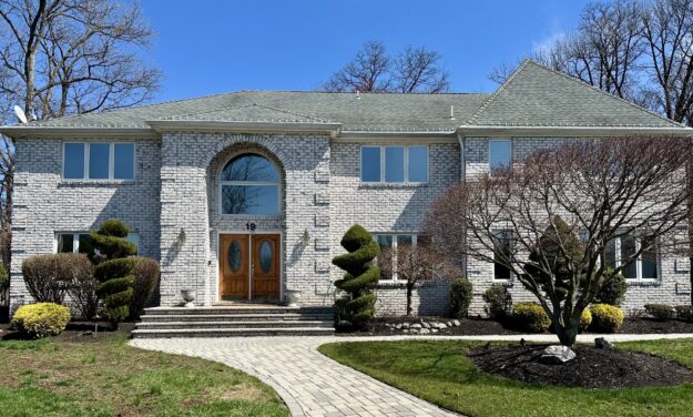 House with professionally installed window tint by Energy Solutions Window Tinting, enhancing privacy, energy efficiency, and curb appeal.